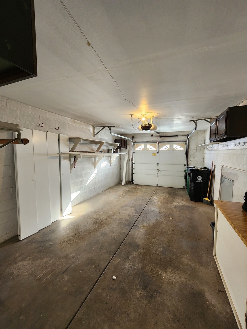 123 Brewster Court, Unit B Bloomingdale, IL 60108 - Photo 22 of 23 a view of a garage