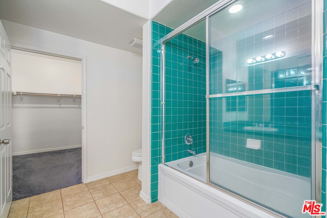 13080 Pacific Promenade, Unit 109 Playa Vista, CA 90094 - Photo 13 of 60 a bathroom with a tub a window and a shower