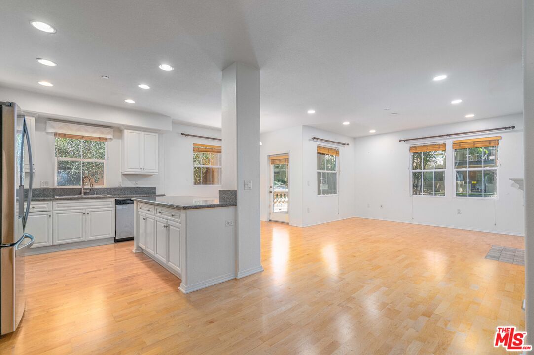 13080 Pacific Promenade, Unit 109 Playa Vista, CA 90094 - Photo 2 of 60 a large kitchen with stainless steel appliances granite countertop a granite counter tops and a window