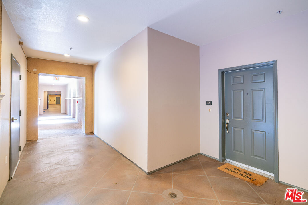 13080 Pacific Promenade, Unit 109 Playa Vista, CA 90094 - Photo 22 of 60 a view of a hallway with wooden floor
