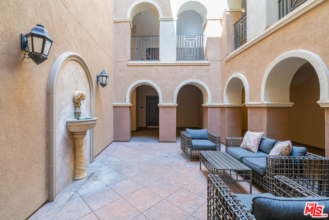 13080 Pacific Promenade, Unit 109 Playa Vista, CA 90094 - Photo 23 of 60 a living room with furniture and a fireplace