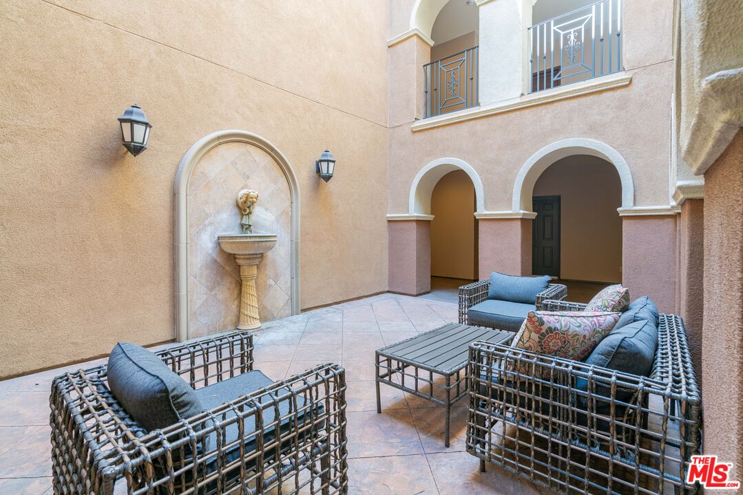 13080 Pacific Promenade, Unit 109 Playa Vista, CA 90094 - Photo 24 of 60 a living room with furniture a rug and a window