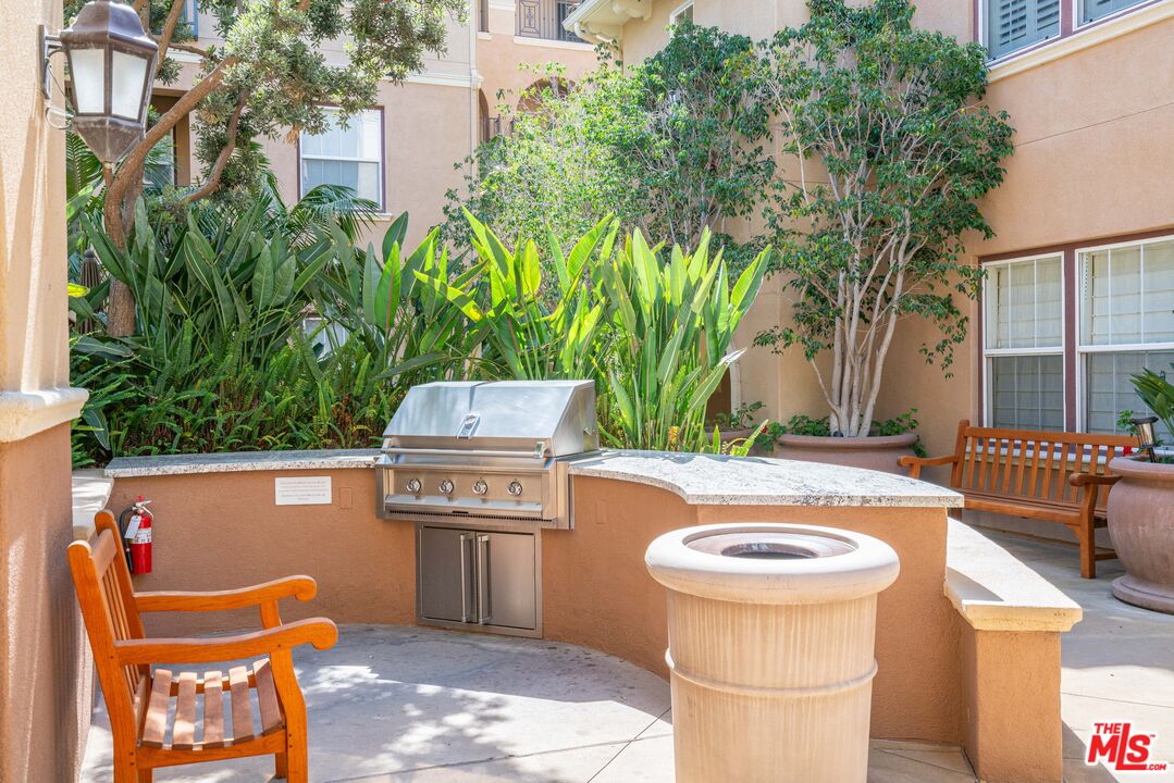 13080 Pacific Promenade, Unit 109 Playa Vista, CA 90094 - Photo 27 of 60 a view of a backyard with swimming pool and furniture