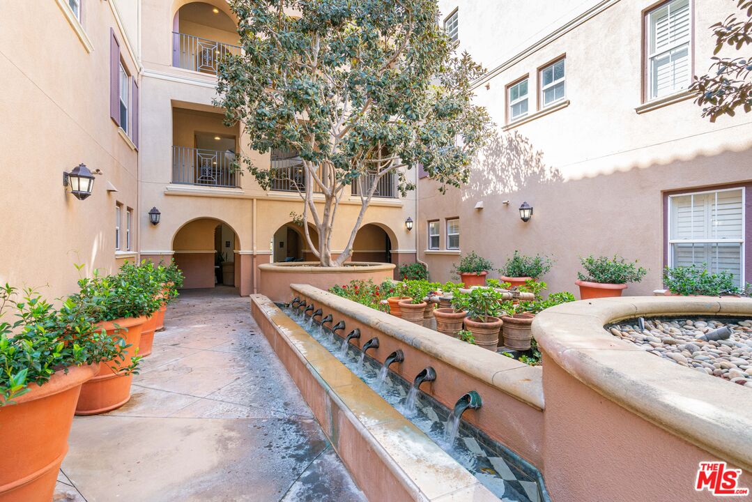 13080 Pacific Promenade, Unit 109 Playa Vista, CA 90094 - Photo 28 of 60 a front view of a house with garden