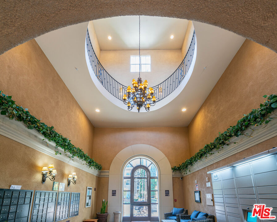 13080 Pacific Promenade, Unit 109 Playa Vista, CA 90094 - Photo 30 of 60 a large room with a large window and chandelier