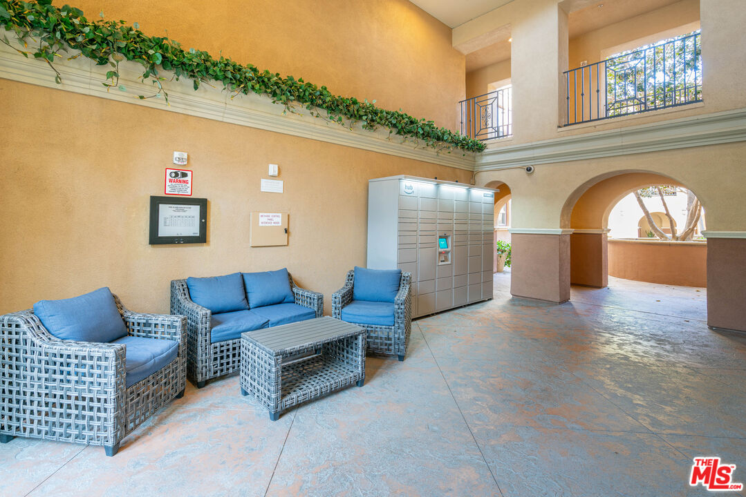 13080 Pacific Promenade, Unit 109 Playa Vista, CA 90094 - Photo 31 of 60 a living room with furniture and a fireplace