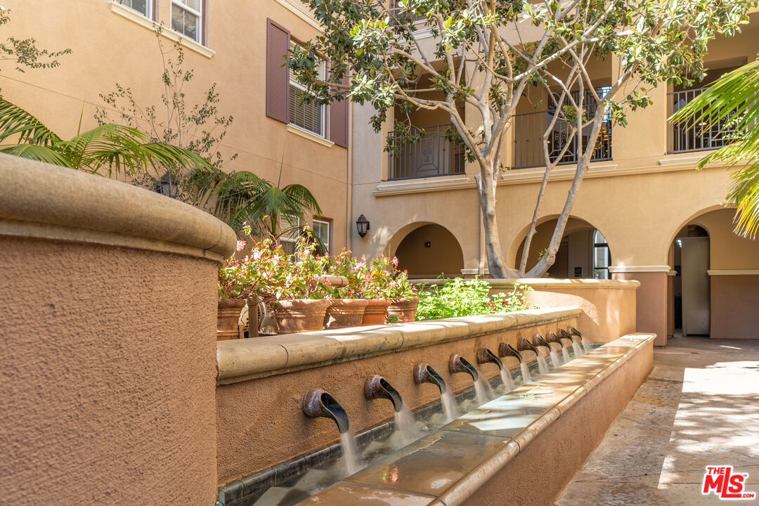 13080 Pacific Promenade, Unit 109 Playa Vista, CA 90094 - Photo 41 of 60 a view of a chairs and table in a balcony