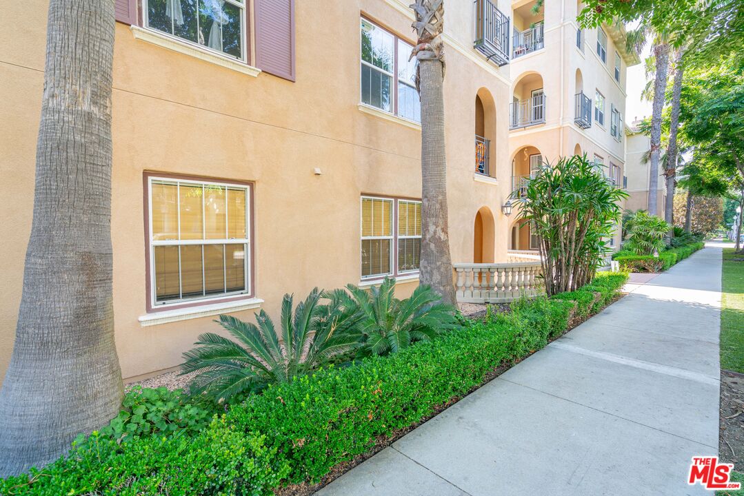 13080 Pacific Promenade, Unit 109 Playa Vista, CA 90094 - Photo 53 of 60 a view of a brick building next to a yard