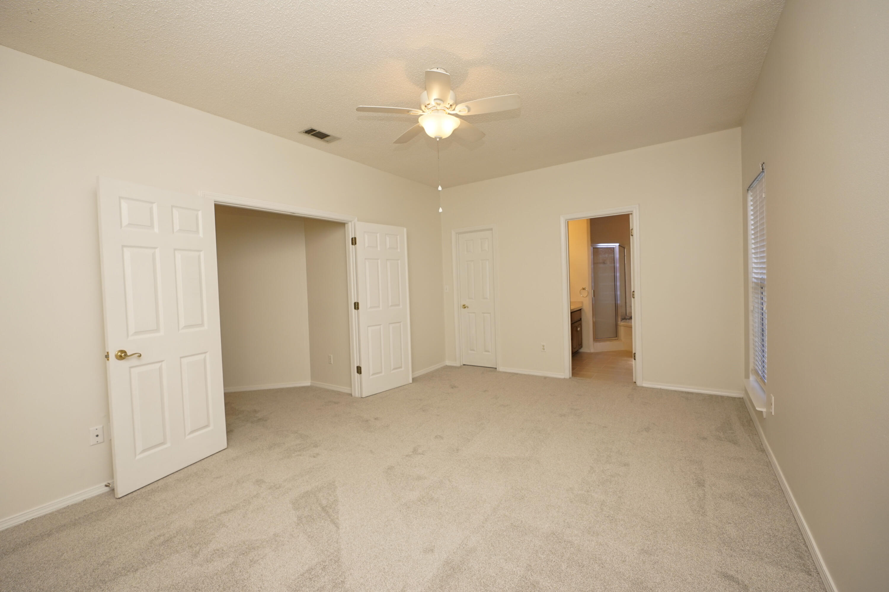 4505 Parkwood Square Niceville, FL 32578 - Photo 14 of 30 a view of an empty room with a ceiling fan