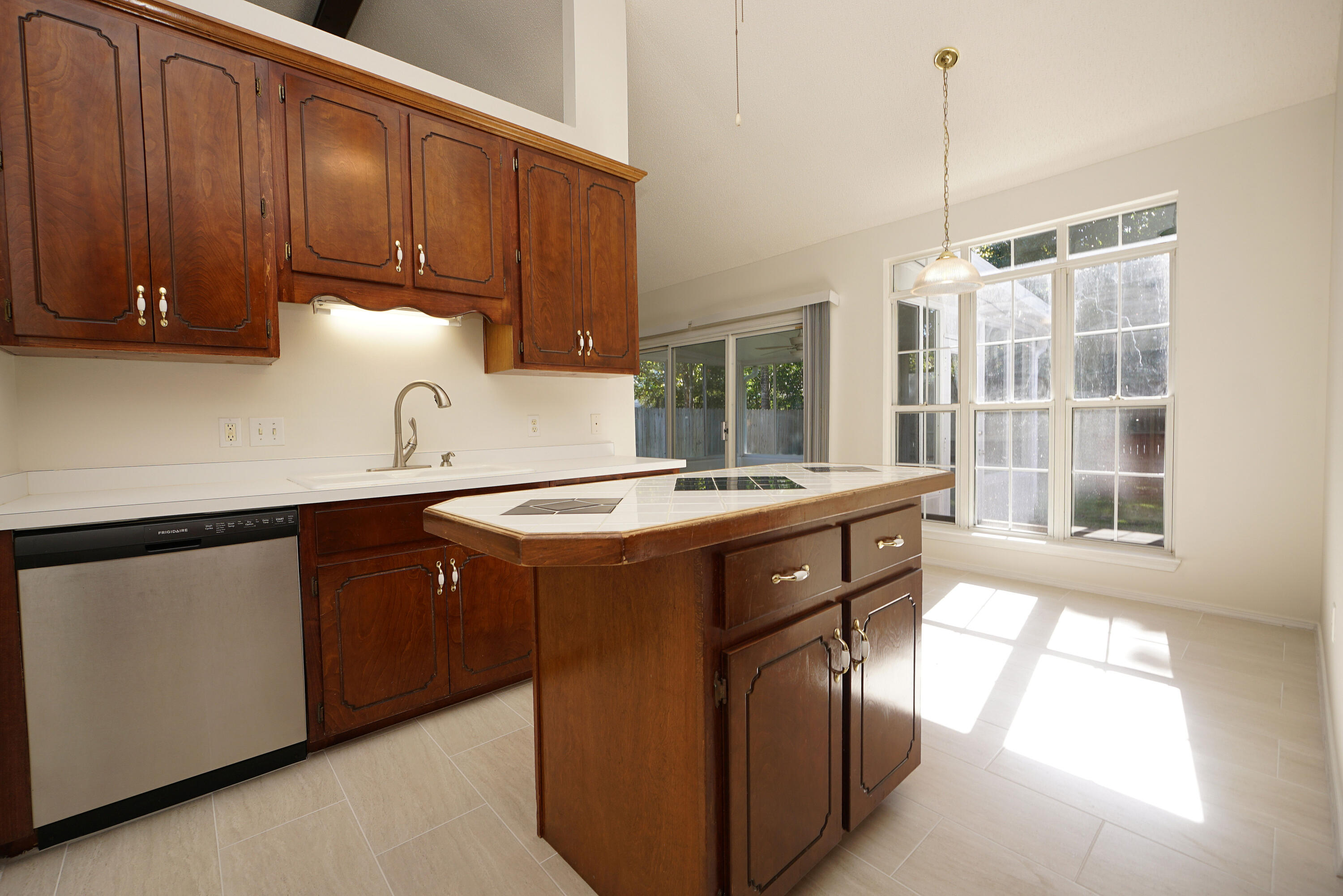 4505 Parkwood Square Niceville, FL 32578 - Photo 4 of 30 a kitchen with stainless steel appliances granite countertop a sink a stove and a wooden floors