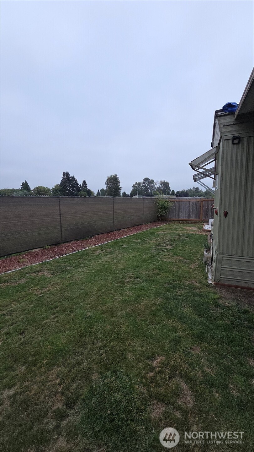 8314 38th Street East, Unit 4 Edgewood, WA 98371 - Photo 21 of 21 a view of a backyard