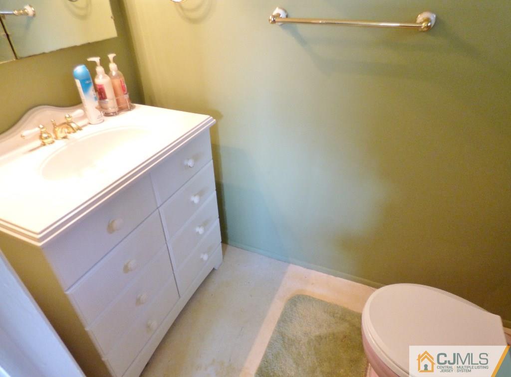 20 Clemson Road Old Bridge, NJ 08859 - Photo 12 of 25 a bathroom with a sink toilet and vanity