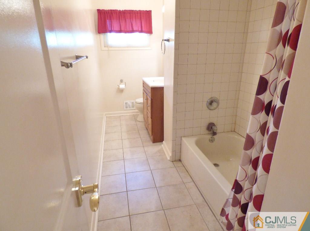 20 Clemson Road Old Bridge, NJ 08859 - Photo 16 of 25 a bathroom with a bathtub and shower