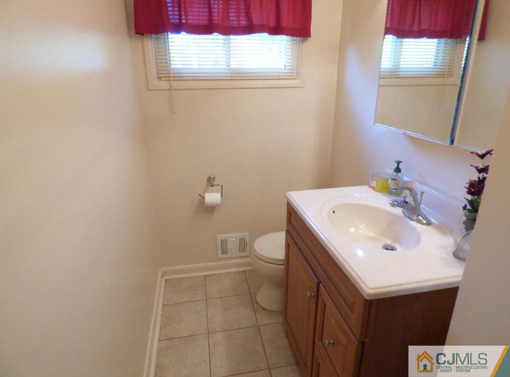 20 Clemson Road Old Bridge, NJ 08859 - Photo 17 of 25 a bathroom with a sink vanity and a toilet