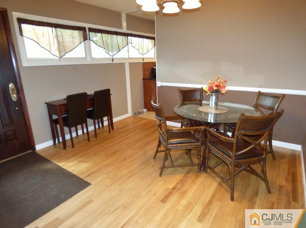 20 Clemson Road Old Bridge, NJ 08859 - Photo 3 of 25 a view of a dining room with furniture and wooden floor