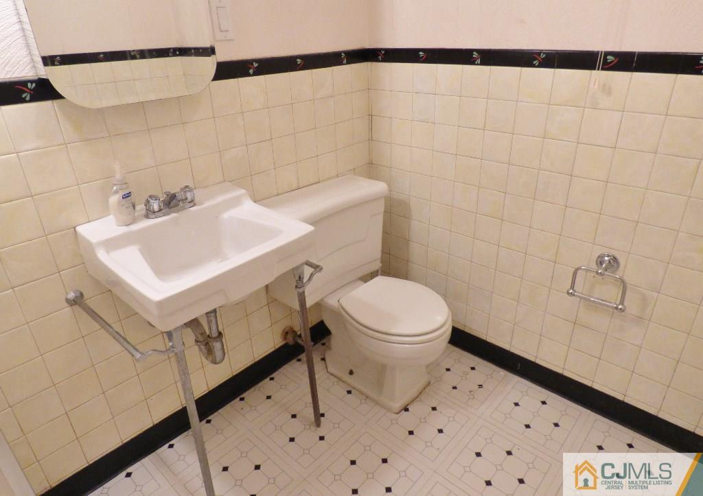 20 Clemson Road Old Bridge, NJ 08859 - Photo 21 of 25 a bathroom with a sink a toilet and vanity