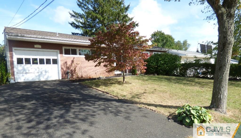 20 Clemson Road Old Bridge, NJ 08859 - Photo 23 of 25 a front view of a house with garden