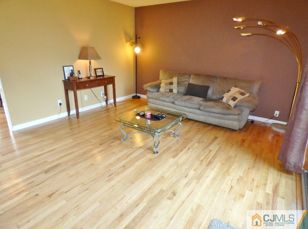 20 Clemson Road Old Bridge, NJ 08859 - Photo 5 of 25 a living room with furniture and a wooden floor