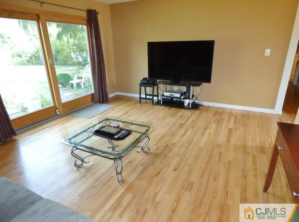 20 Clemson Road Old Bridge, NJ 08859 - Photo 6 of 25 a living room with furniture and a flat screen tv