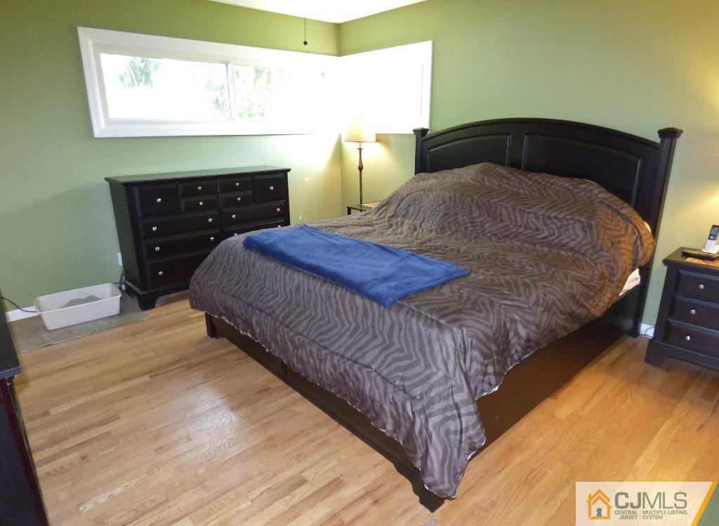 20 Clemson Road Old Bridge, NJ 08859 - Photo 10 of 25 a bedroom with a bed and a dresser