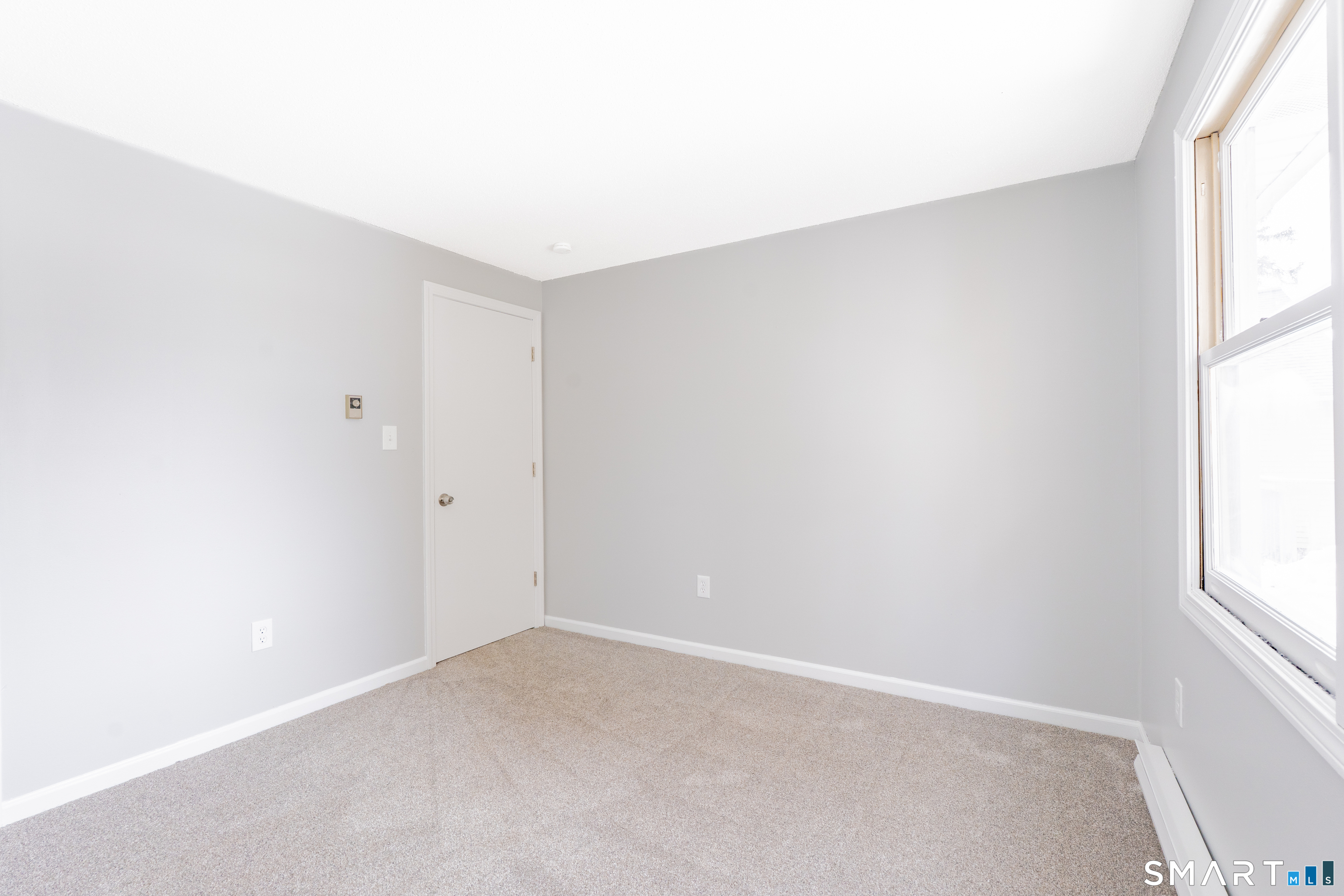 28 Orient Street Meriden, CT 06450 - Photo 12 of 18 a view of an empty room and a window