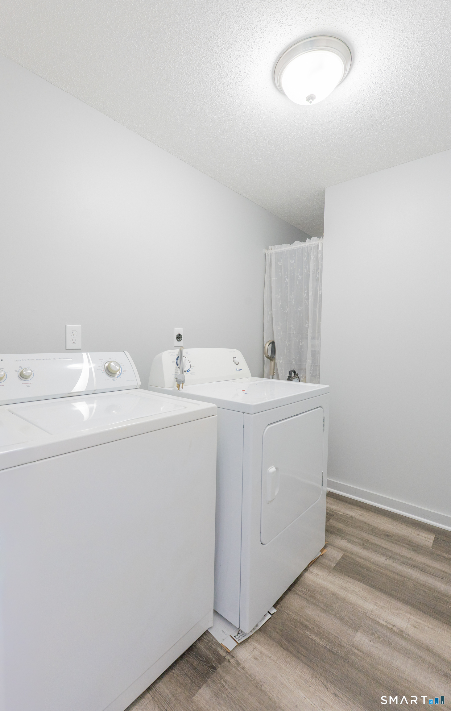 28 Orient Street Meriden, CT 06450 - Photo 17 of 18 a utility room with dryer and washer