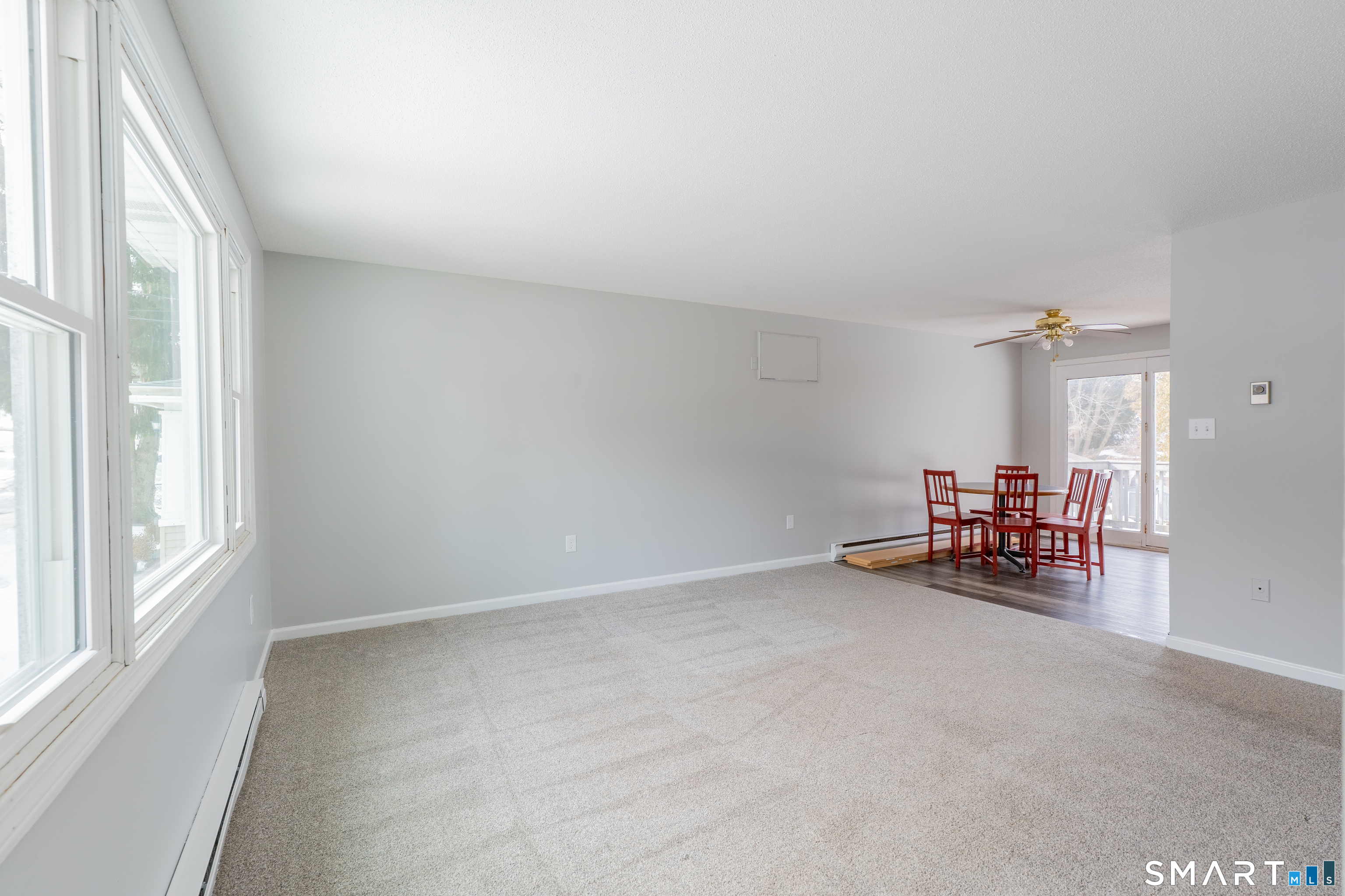 28 Orient Street Meriden, CT 06450 - Photo 2 of 18 an empty room with furniture and a window