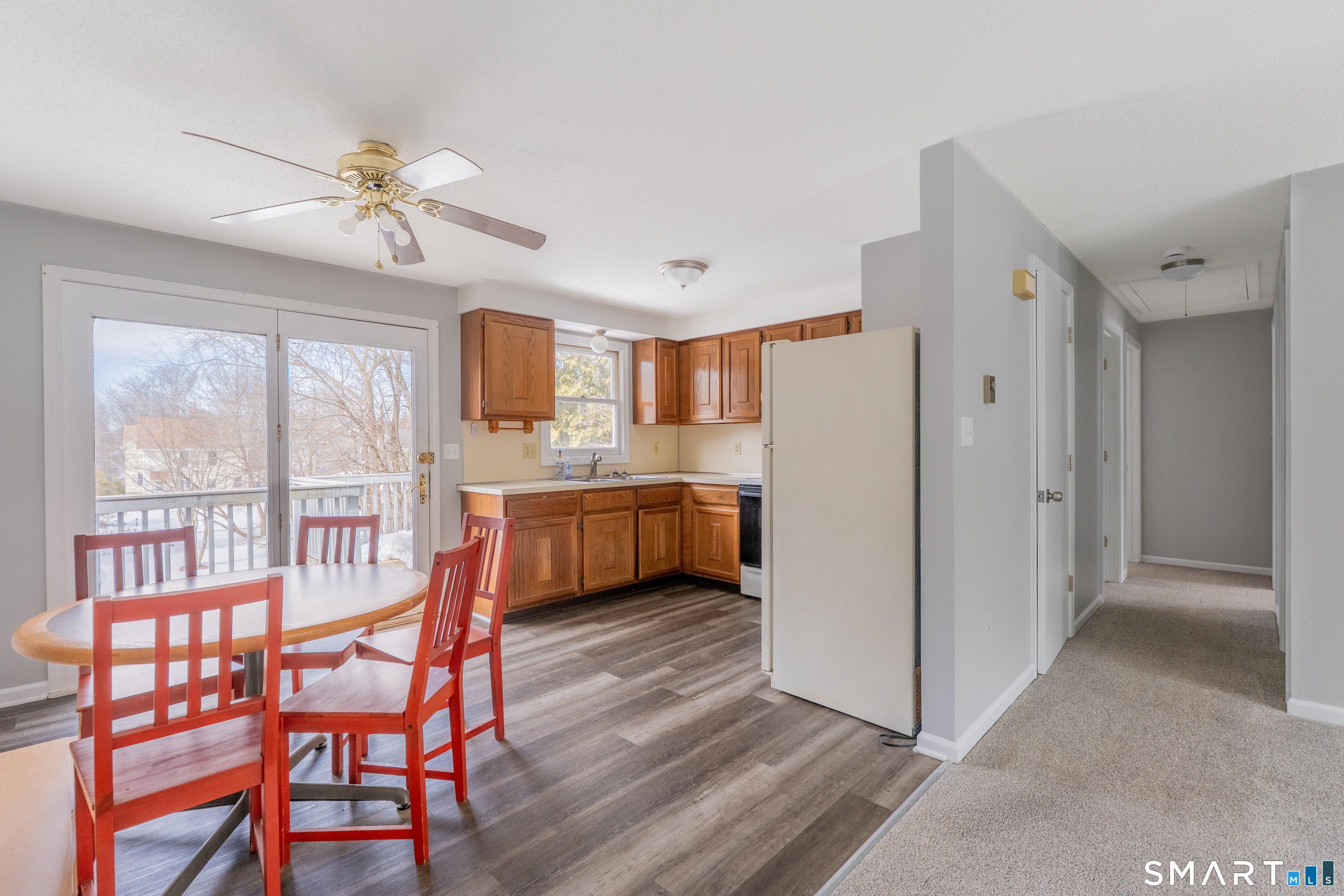 28 Orient Street Meriden, CT 06450 - Photo 5 of 18 a kitchen with stainless steel appliances a stove a refrigerator a dining table and chairs
