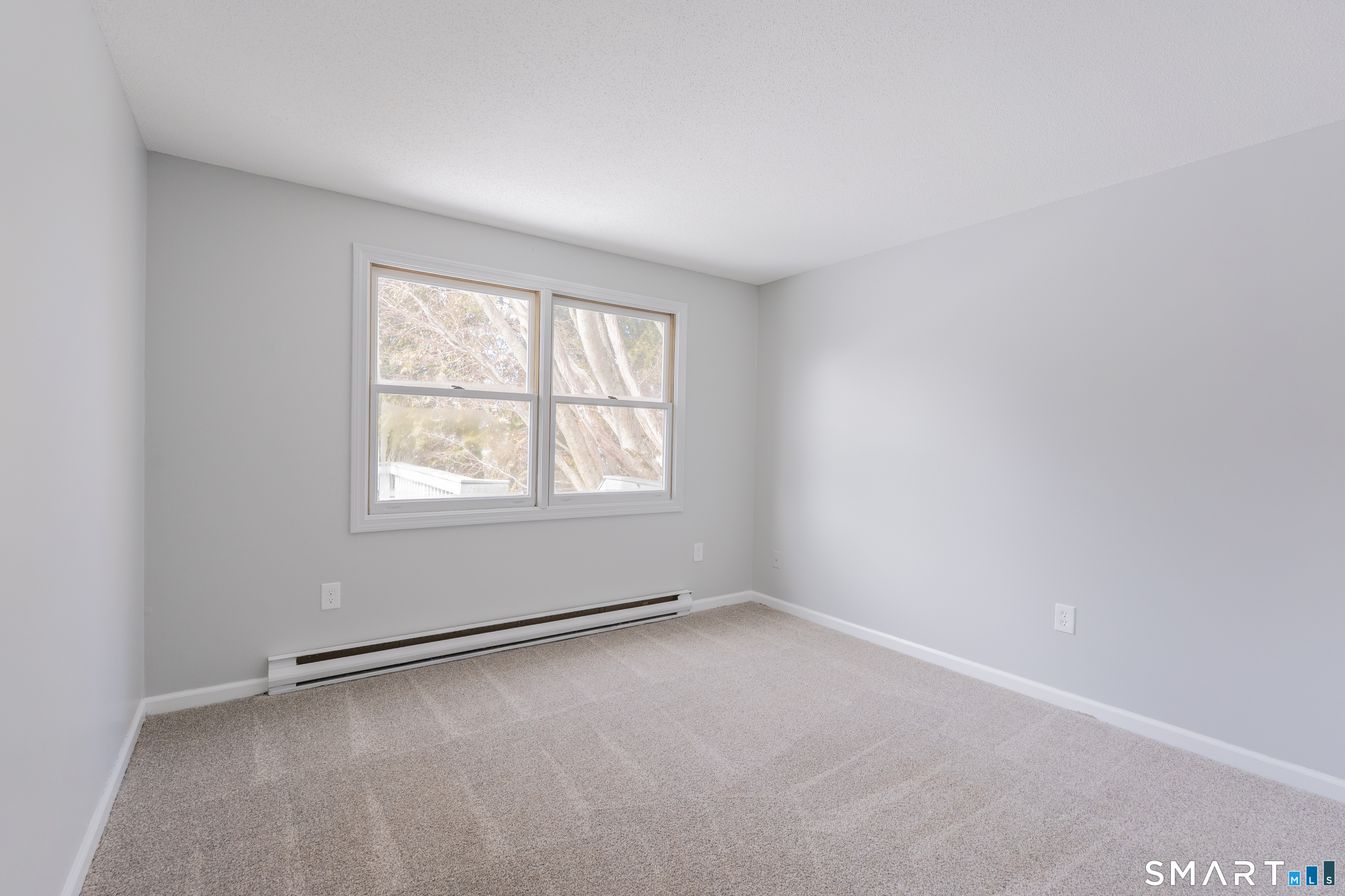 28 Orient Street Meriden, CT 06450 - Photo 9 of 18 an empty room with a window