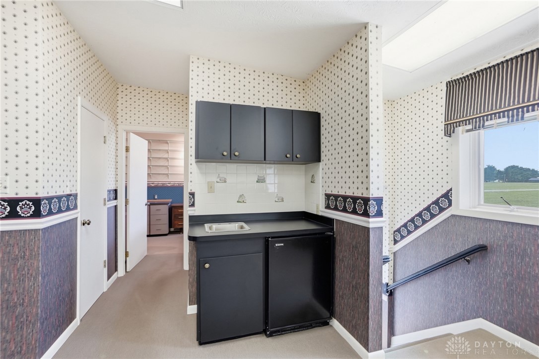 5669 O Neall Road Waynesville, OH 45068 - Photo 62 of 72 This versatile area offers convenience with its compact kitchenette and easy access to other rooms.