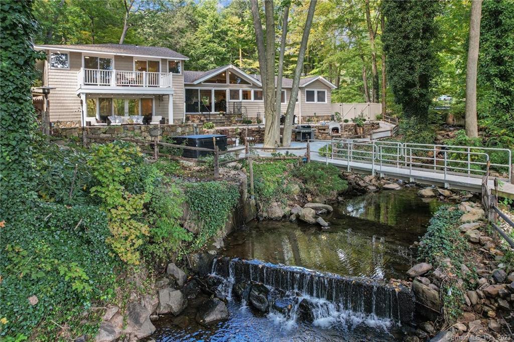 198 Old Dike Road Trumbull, CT 06611 - Photo 1 of 1 a view of lake with a house and a yard