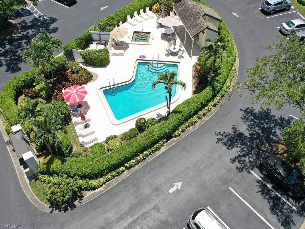 1633 Spoonbill Lane, Unit 1633C Naples, FL 34105 - Photo 28 of 35 an aerial view of a house having outdoor space