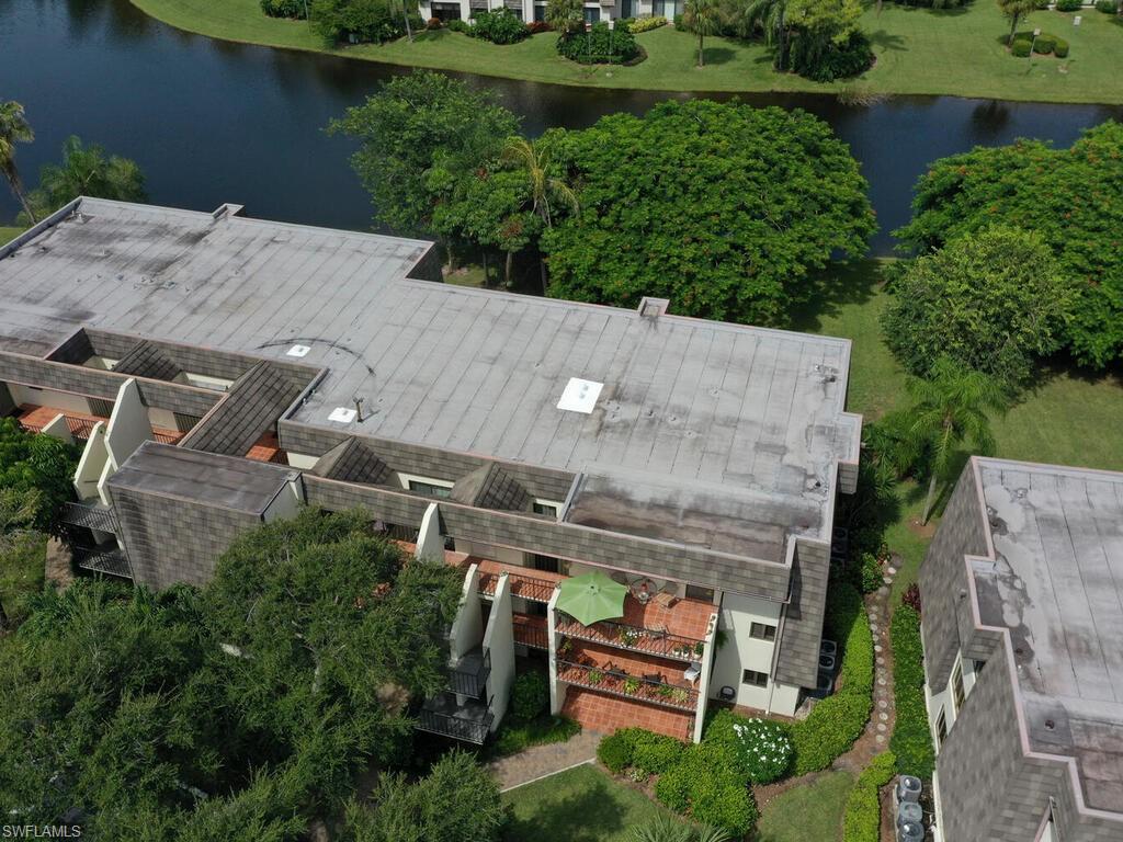 1633 Spoonbill Lane, Unit 1633C Naples, FL 34105 - Photo 29 of 35 an aerial view of a house with outdoor space and street view