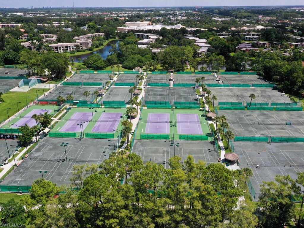 1633 Spoonbill Lane, Unit 1633C Naples, FL 34105 - Photo 33 of 35 an aerial view of multiple house