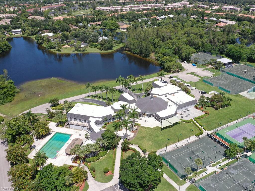 1633 Spoonbill Lane, Unit 1633C Naples, FL 34105 - Photo 34 of 35 an aerial view of a house with a yard