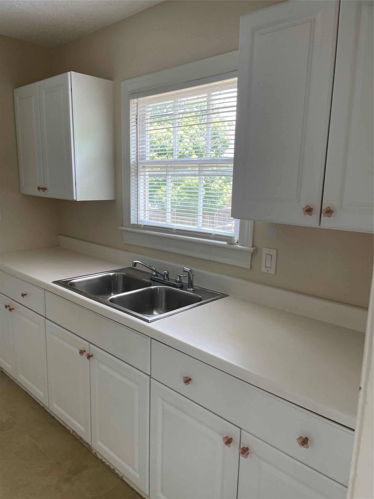 2030 Bissonnet Street Houston, TX 77005 - Photo 11 of 25 a kitchen with a sink cabinets and window