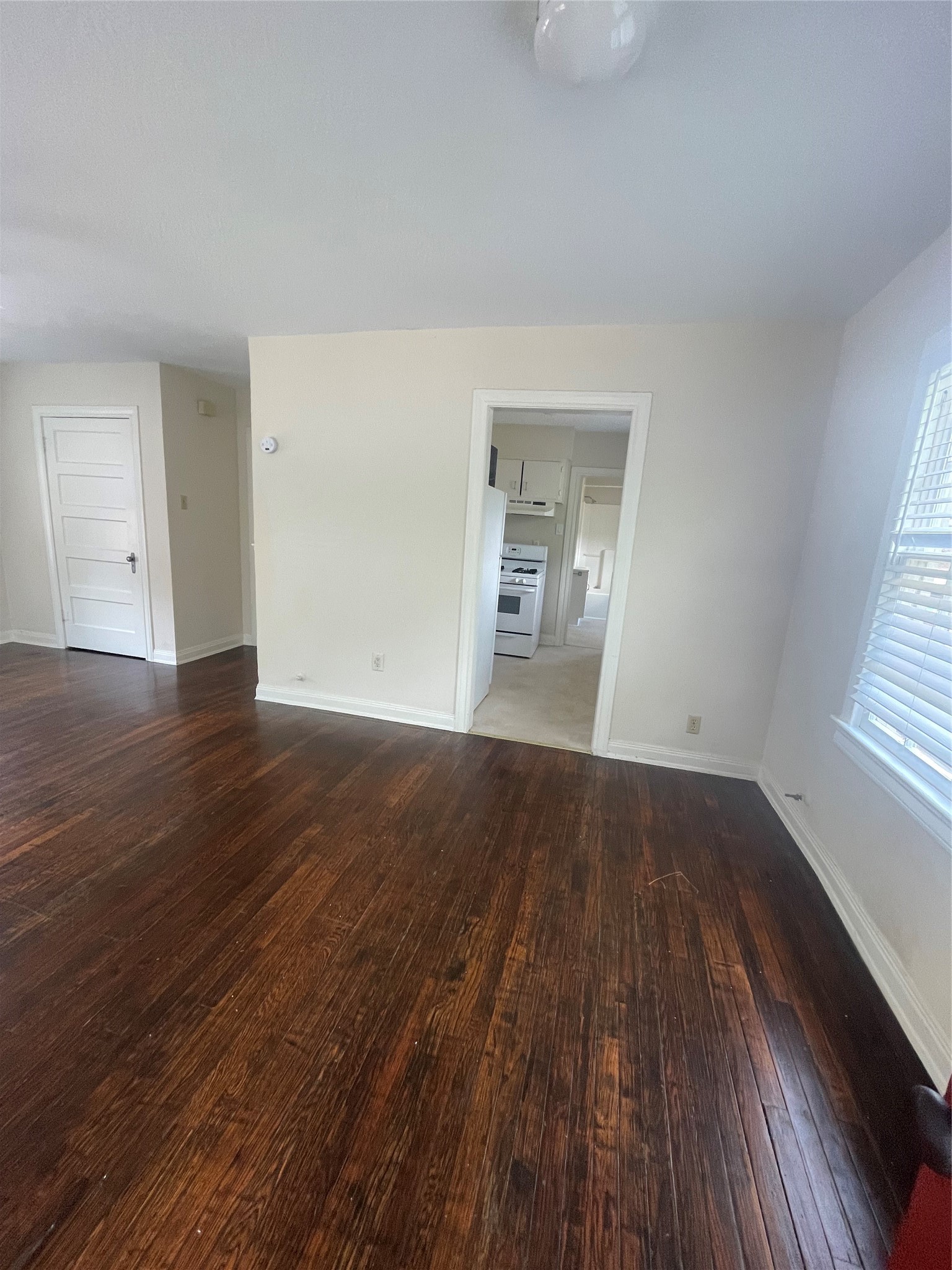 2030 Bissonnet Street Houston, TX 77005 - Photo 12 of 25 an empty room with wooden floor and windows