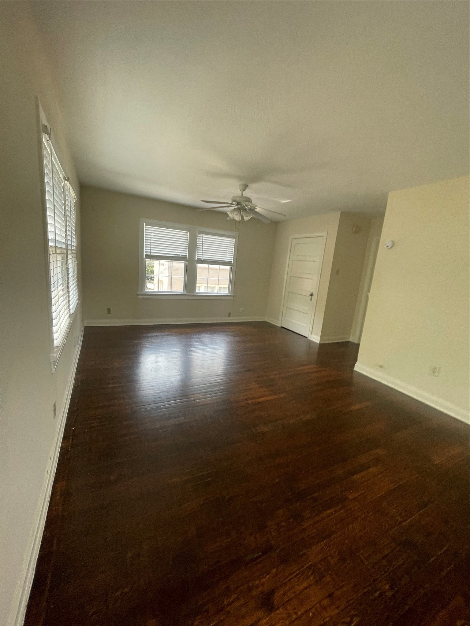 2030 Bissonnet Street Houston, TX 77005 - Photo 13 of 25 an empty room with wooden floor and windows