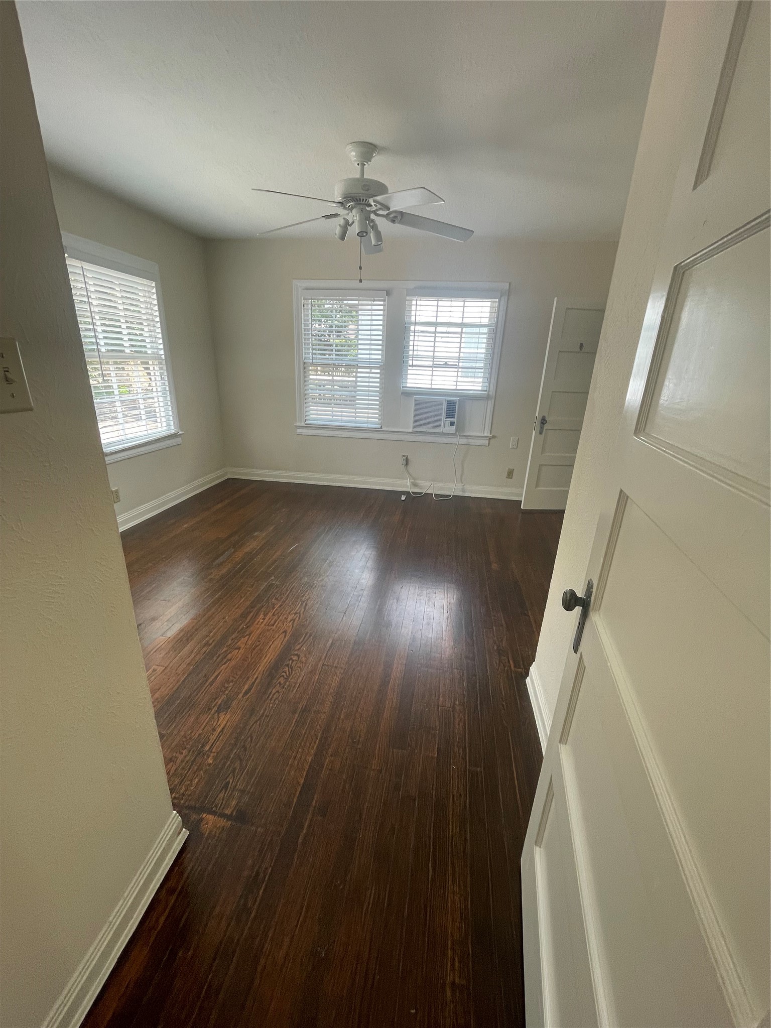 2030 Bissonnet Street Houston, TX 77005 - Photo 15 of 25 a view of a room with wooden floor and windows