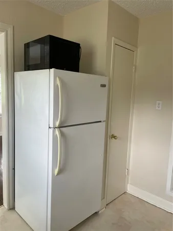 a stove top oven sitting inside of a kitchen