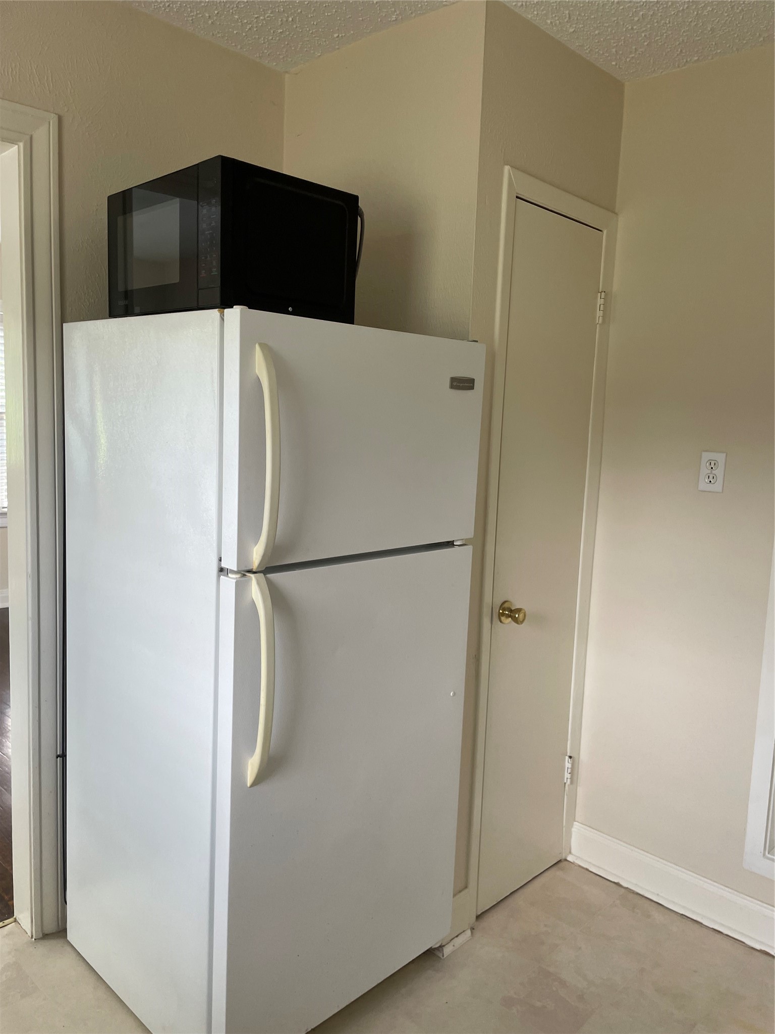 2030 Bissonnet Street Houston, TX 77005 - Photo 16 of 25 a close view of a refrigerator in kitchen and white cabinets