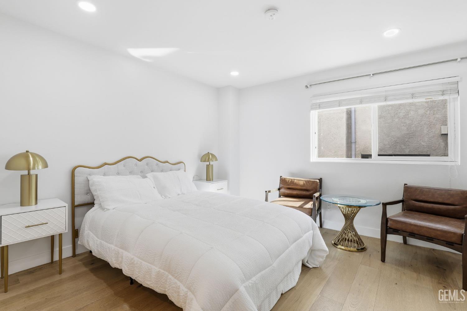 Undisclosed Address North Hollywood, CA 91602 - Photo 11 of 30 a bedroom with bed and chair