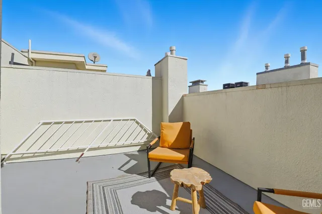a blue and white sitting area with in the background