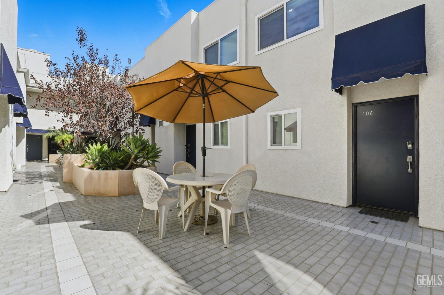 Undisclosed Address North Hollywood, CA 91602 - Photo 21 of 30 a view of a patio with a table and chairs under an umbrella