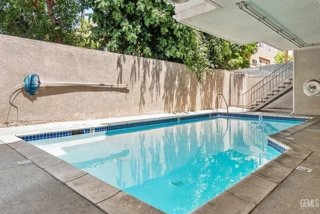a view of outdoor space with swimming pool and outdoor seating