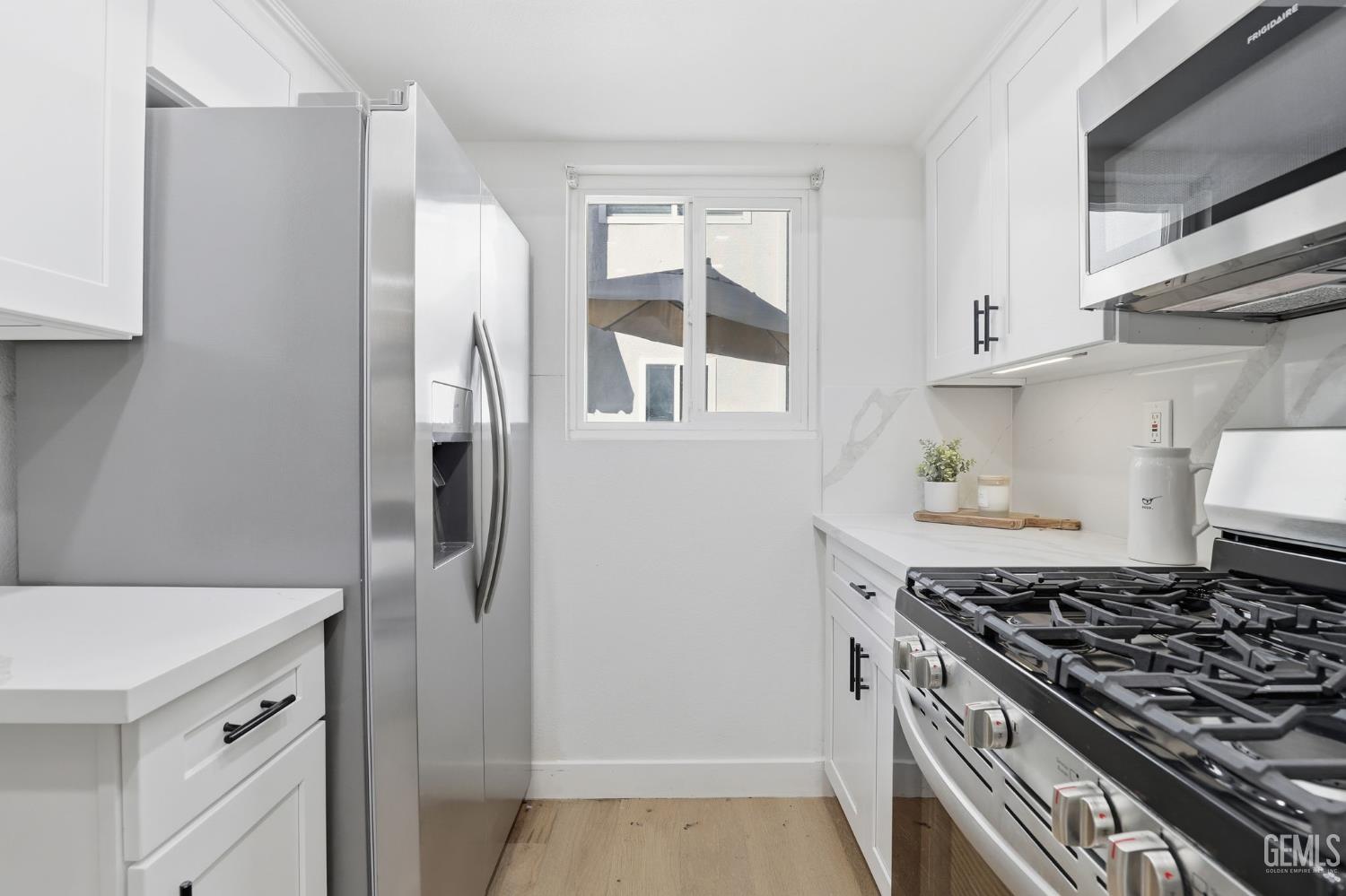 Undisclosed Address North Hollywood, CA 91602 - Photo 7 of 30 a kitchen with stainless steel appliances granite countertop a refrigerator and a stove