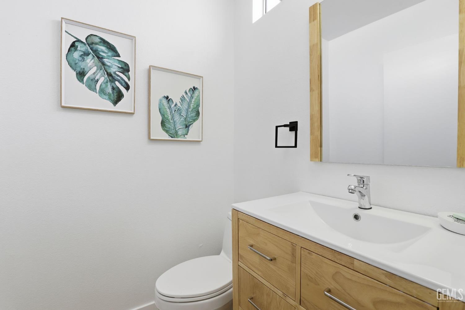 Undisclosed Address North Hollywood, CA 91602 - Photo 9 of 30 a bathroom with a toilet a sink and mirror