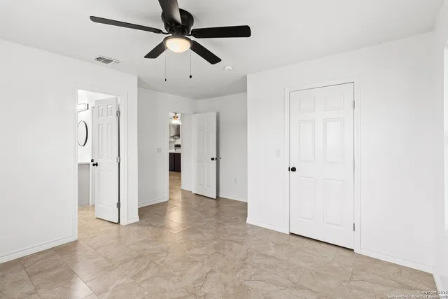 a view of an empty room with a window