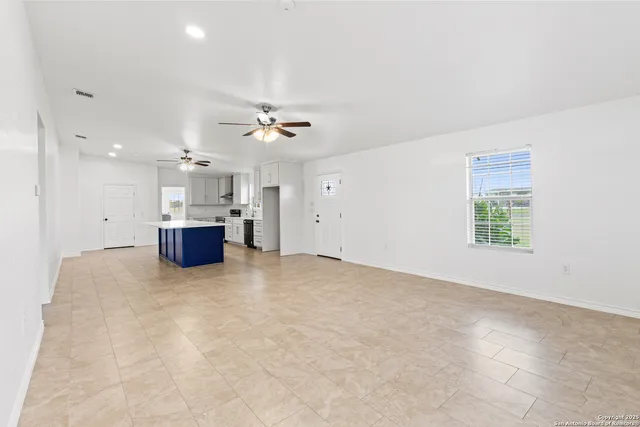 a view of kitchen and kitchen with furniture