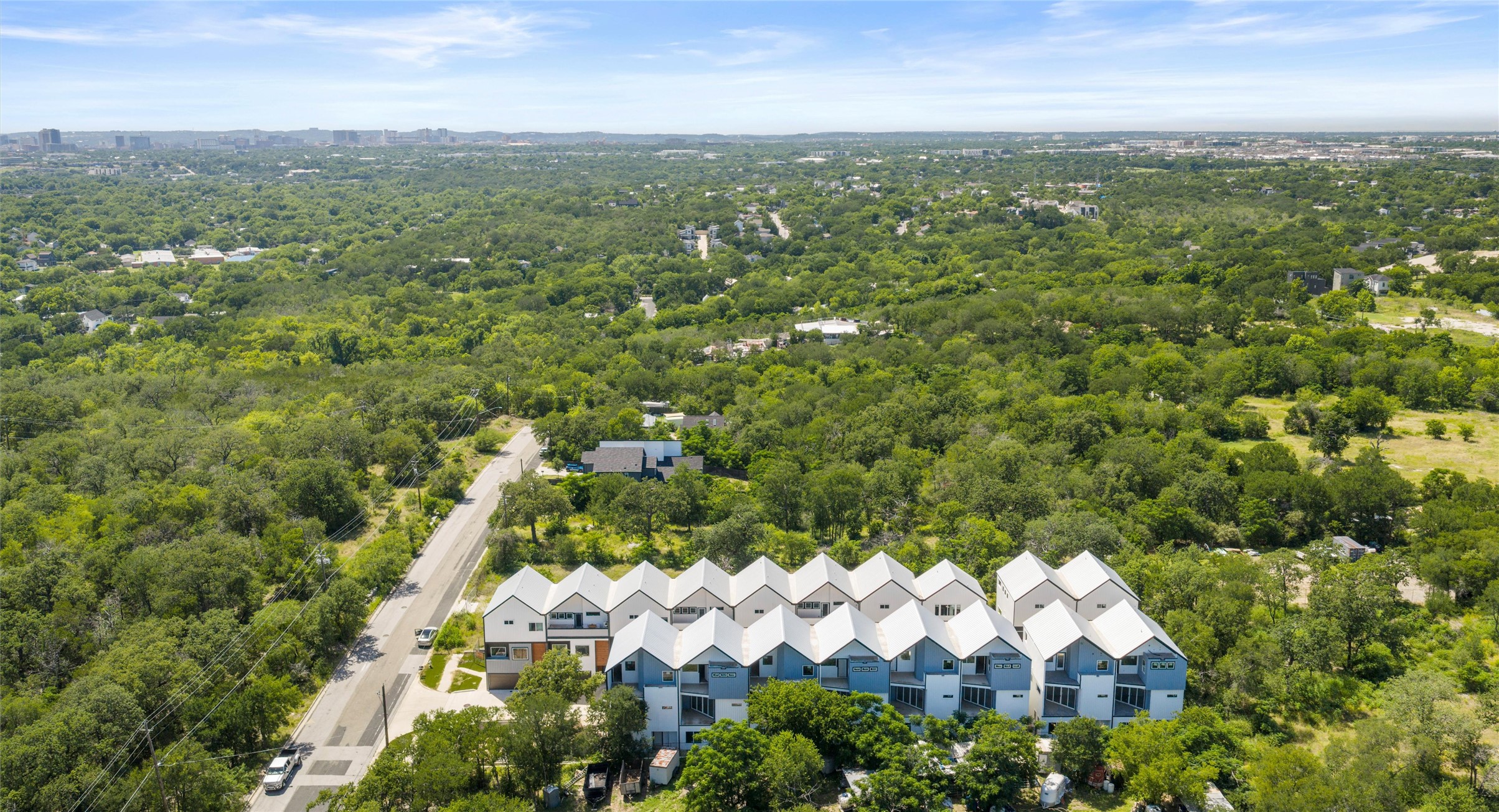 5912 Harold Court, Unit 107 Austin, TX 78721 - Photo 19 of 35 The skyline on the horizon places downtown's dining, music, and culture just minutes from your door. Model No. 105 Shown.